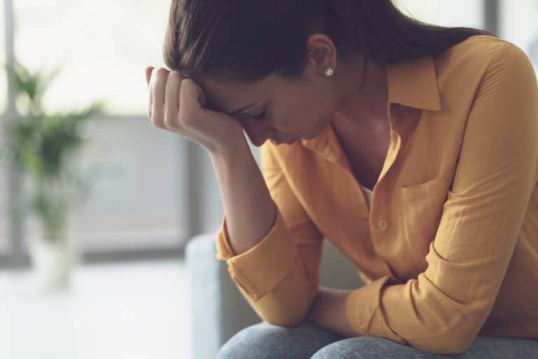 depressed lonely woman sitting at home